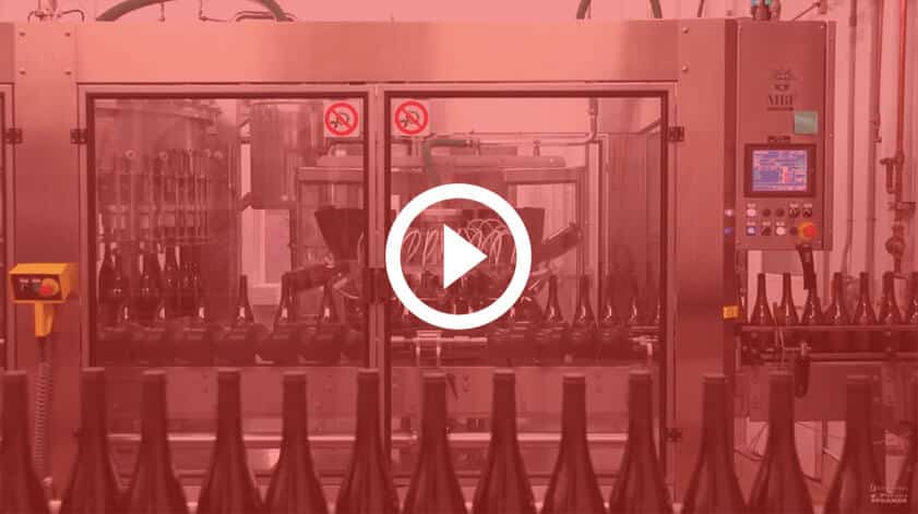 bottling line at winery with red overlay and play button