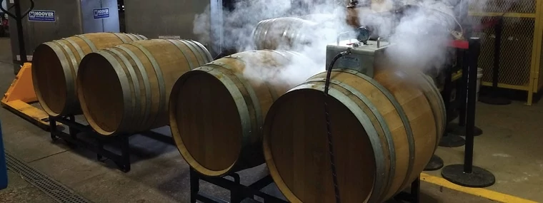 Optima Steamer Wine Barrel Tool by Steamericas being used to steam sanitize and clean wooden wine barrels used by craft breweries